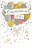 The image depicts a refined yet playful congratulations card that feels ready-made for those proud, once-in-a-lifetime achievements celebrated around Lee, from first homes to new jobs. The design centres on a lush bouquet of illustrated balloons, grouped together so they appear to float upward from the lower edge of the card and fan out across the surface. The balloons are soft and rounded, rendered in a harmonious blend of gold, silver, blush pink, sky blue, and soft grey, each adorned with its own pattern of tiny stars, slender stripes, or delicate glitter-like spotting that adds sparkle without overwhelming the look. Slim metallic ribbons in hues of gold and silver cascade from the base of the balloon cluster, looped into graceful curves that bring movement and life to the scene, as if caught in the air at a celebration near Manor House Gardens or along Burnt Ash Road. Across the centre of this floating bouquet sits a crisp white banner, gently arched, carrying the wording "Congratulations To You" in an elegant, handwritten-style script that radiates sincerity and warmth. The background is pale and gently textured, dusted with small metallic stars, swirling streamers, and light confetti motifs that drift around the balloons like echoes of laughter after a big announcement. Subtle gloss and glitter accents appear to highlight certain areas, suggesting that parts of the card would shimmer softly under natural light from a nearby window. The card's overall mood is one of bright optimism and genuine pride, an ideal finishing touch to accompany a thoughtful floral gift when you want to celebrate success in a way that feels both special and deeply personal.